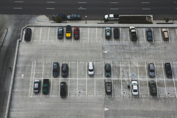What are the best practices for real estate developers in addressing parking demands in urban projects?